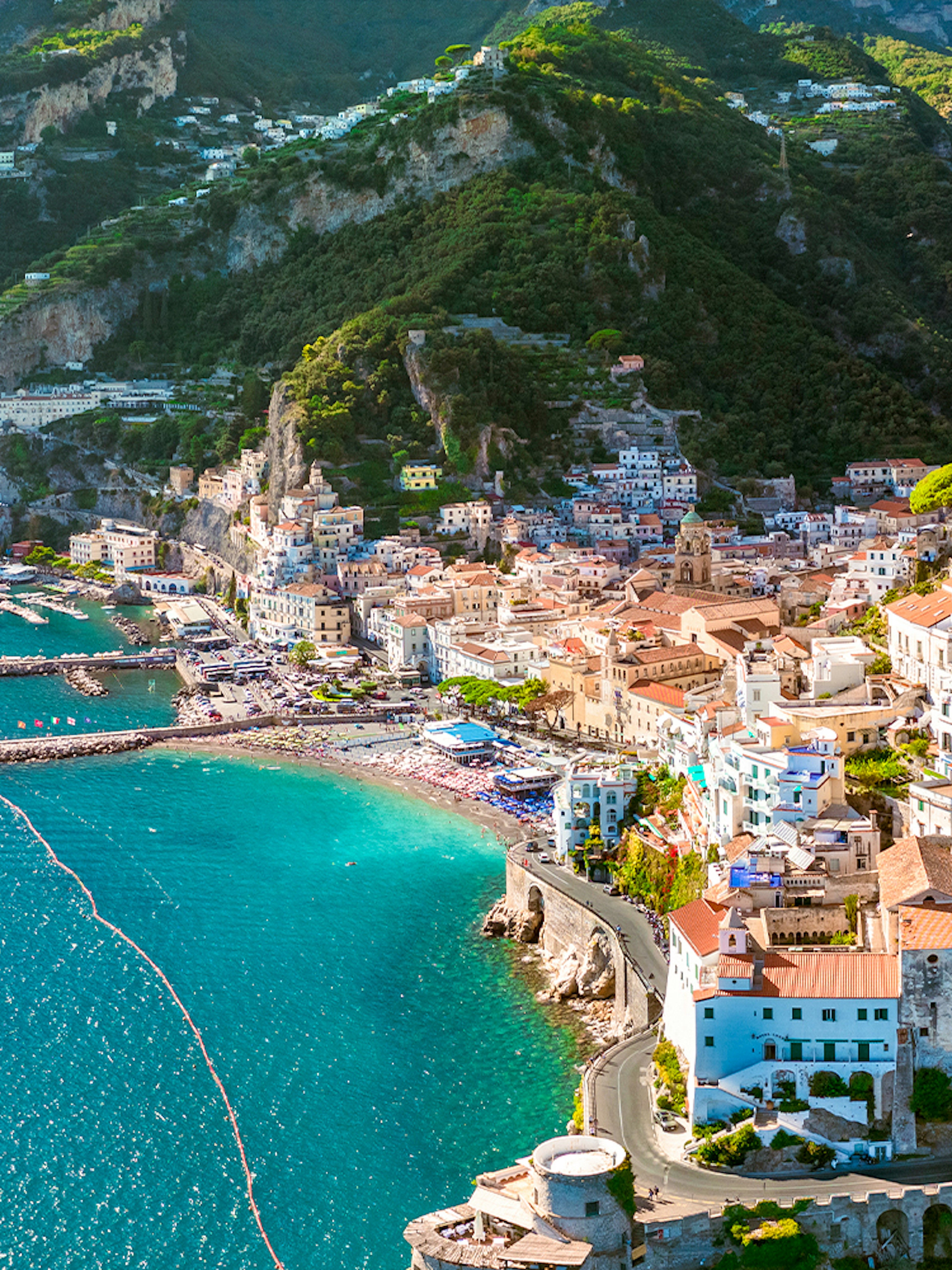 Aerial view of Amalfi Coast with colorful buildings and turquoise sea on a day trip.