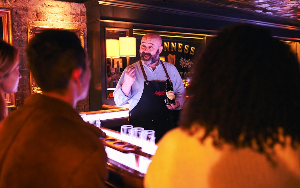 Guinness expert leading a tasting session at the Guinness Connoisseur Experience in Dublin.