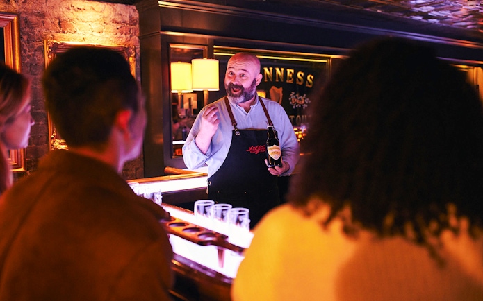 Guinness expert leading a tasting session at the Guinness Connoisseur Experience in Dublin.