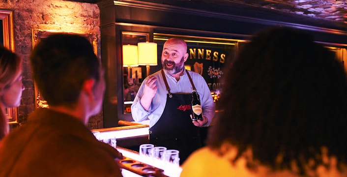 Guinness expert leading a tasting session at the Guinness Connoisseur Experience in Dublin.