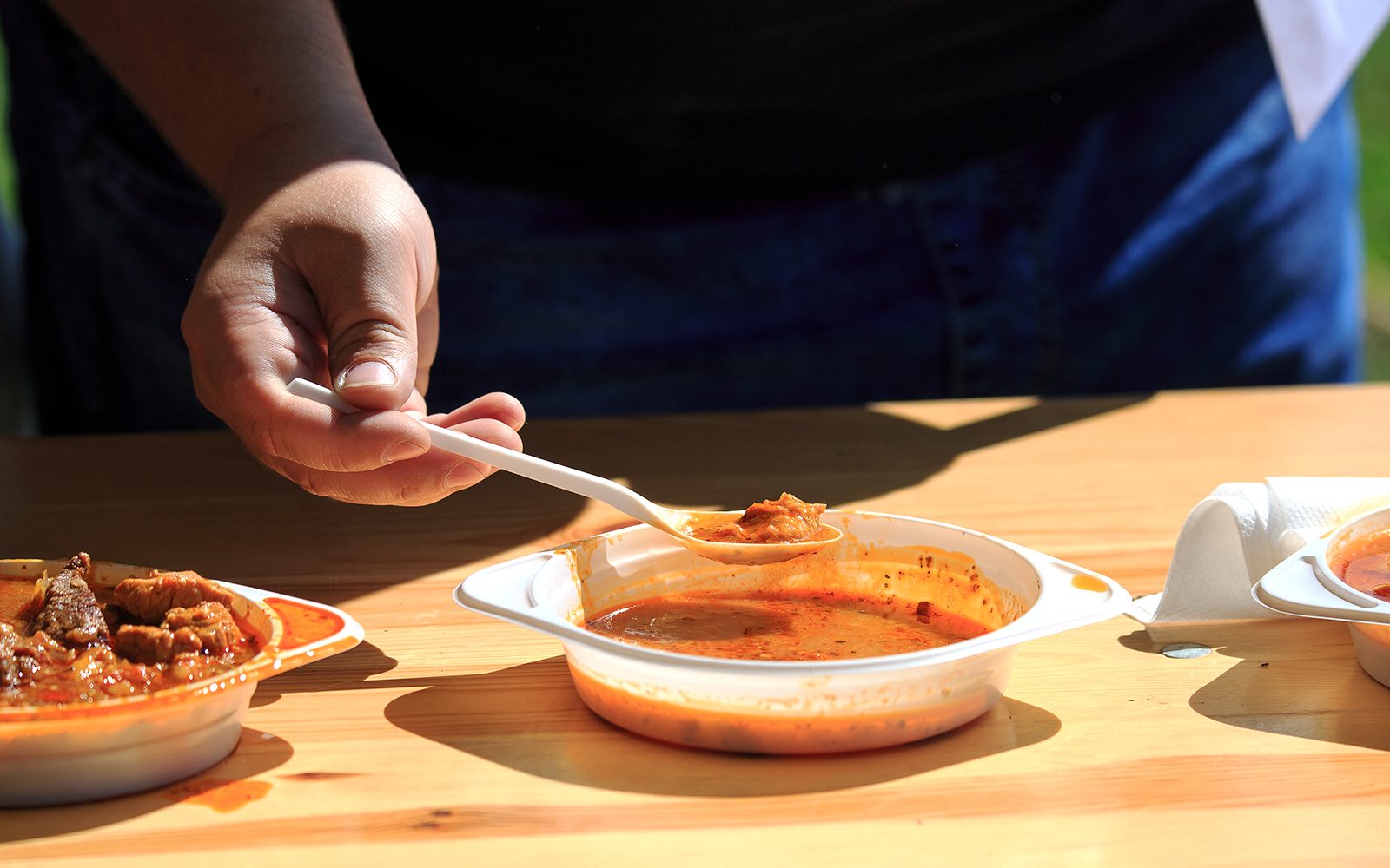 Reindeer sledding with Sami guide in snowy Lapland, traditional Sami food experience.