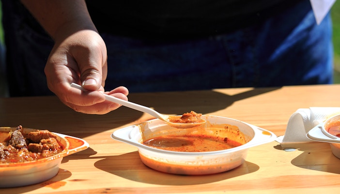 Reindeer sledding with Sami guide in snowy Lapland, traditional Sami food experience.