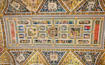 Ceiling frescoes in Piccolomini Library, Siena Cathedral, featuring intricate Renaissance artwork.