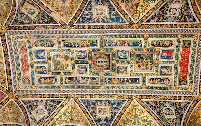 Ceiling frescoes in Piccolomini Library, Siena Cathedral, featuring intricate Renaissance artwork.