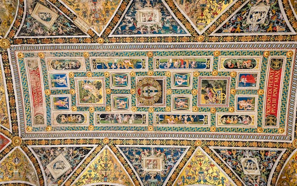 Ceiling frescoes in Piccolomini Library, Siena Cathedral, featuring intricate Renaissance artwork.