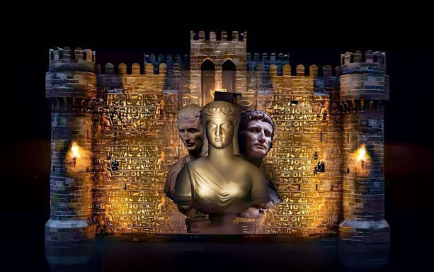 Qaitbay Citadel illuminated with ancient statues projected on its walls.