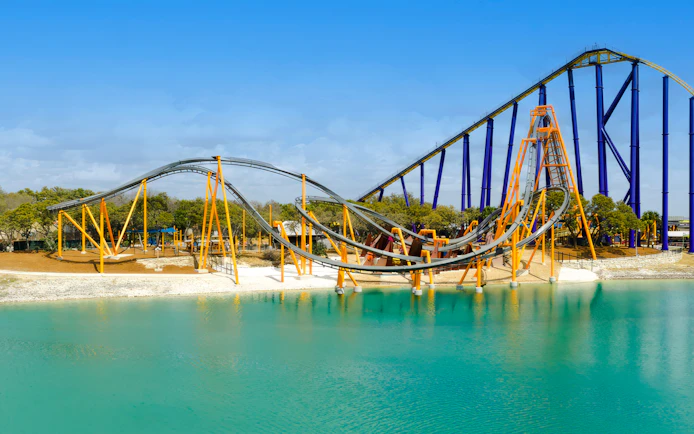 Barracuda Strike roller coaster over water at SeaWorld San Antonio.