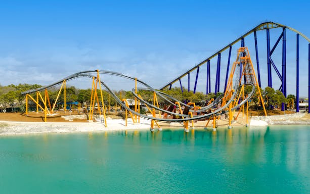 Barracuda Strike roller coaster over water at SeaWorld San Antonio.