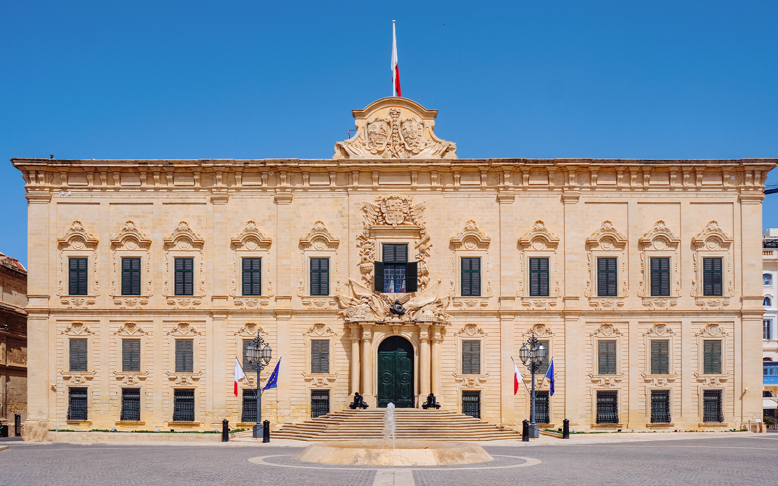 Facade of Auberge de Castille in Valletta, Malta with ornate architectural details.