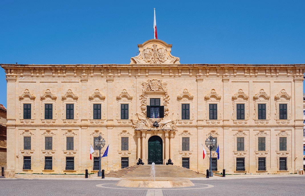 Facade of Auberge de Castille in Valletta, Malta with ornate architectural details.