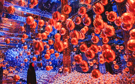 Interactive art installation with floating spheres at Team Lab Abu Dhabi.