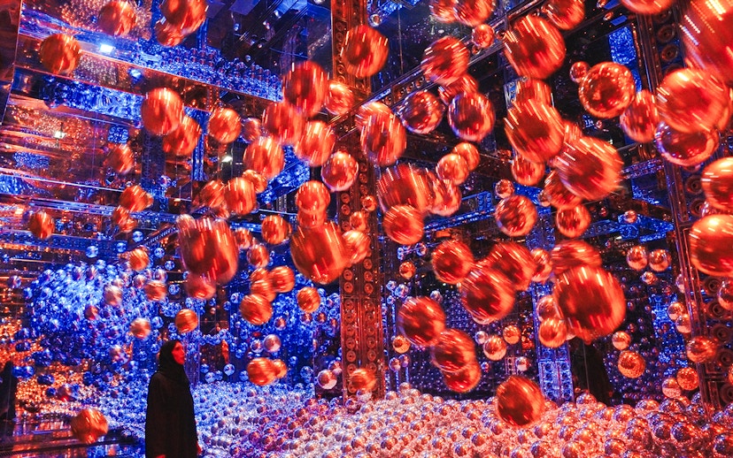 Interactive art installation with floating spheres at Team Lab Abu Dhabi.
