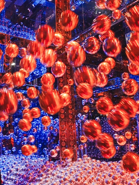 Interactive art installation with floating spheres at Team Lab Abu Dhabi.