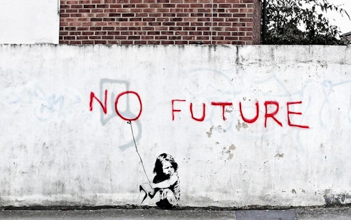 Graffiti of "No Future" with a child holding a balloon on a wall, related to The Little Prince Exhibition.