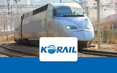 High-speed KTX train on tracks in South Korea, promoting KORAIL Pass.