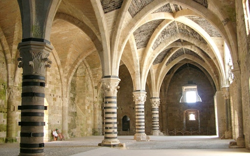 Interior arches and columns of Maniace Castle in Syracuse, Italy.