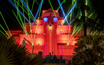 Aquaventure After Dark exterior with colorful laser lights.