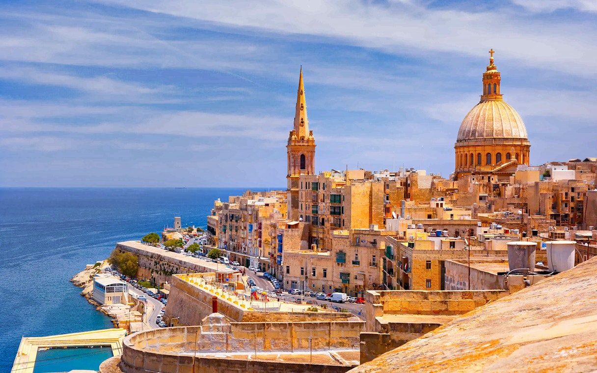 Valletta skyline with St. Paul's Cathedral and the Mediterranean Sea, Malta.