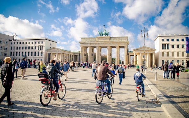 Cyclists near Brandenburg Gate in Berlin with Berlin WelcomeCard.