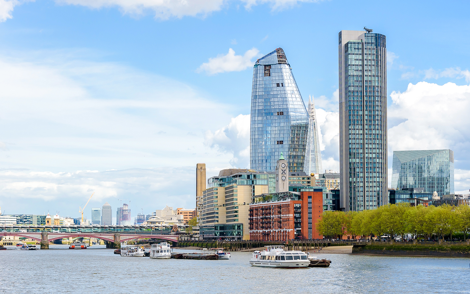 River Thames view with OXO Tower and modern buildings in London.