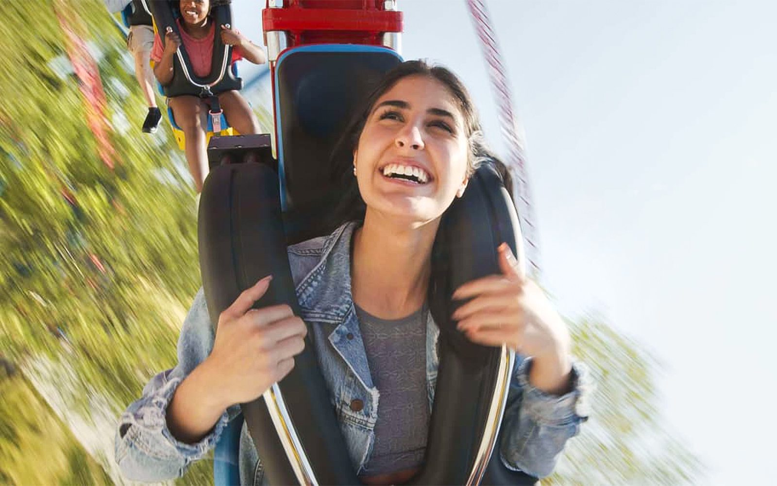 Riders enjoying the SUPERGIRL™ Sky Flyer at Six Flags New England, Boston.