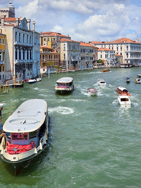 Vaporetto on Grand Canal in Venice, Italy with historic buildings in view.