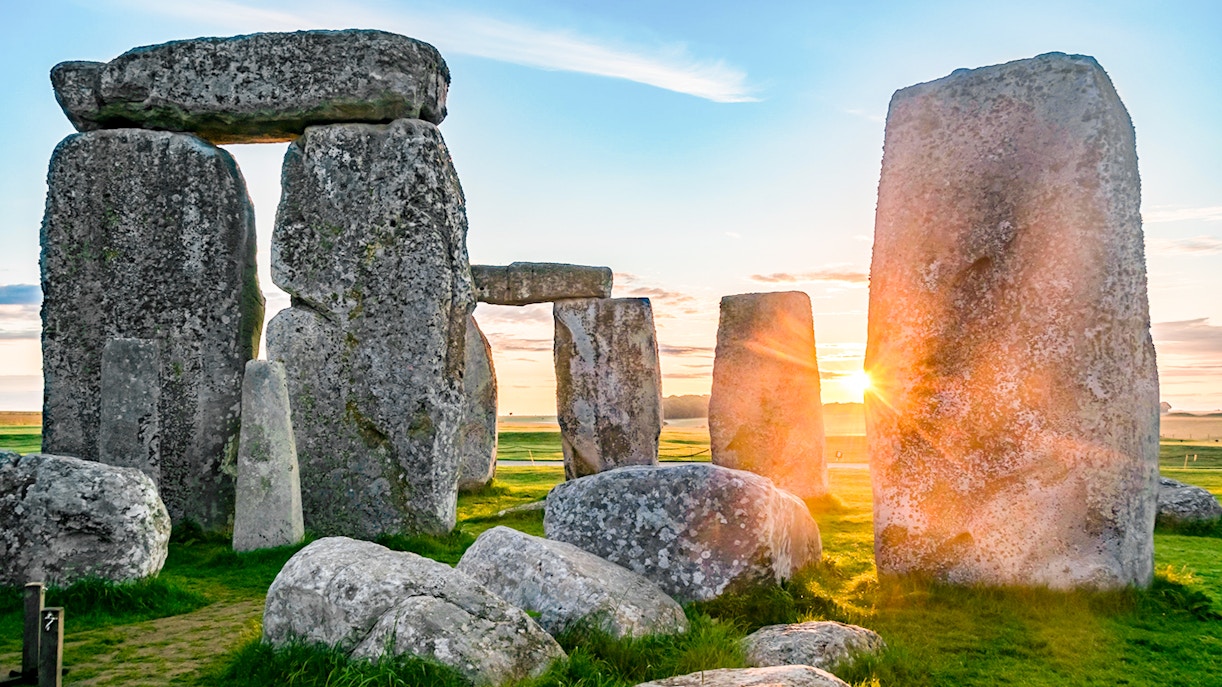 Stonehenge stones at sunrise during a full-day tour from London.