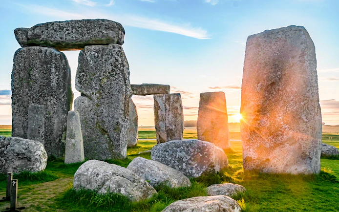 Stonehenge stones at sunrise during a full-day tour from London.