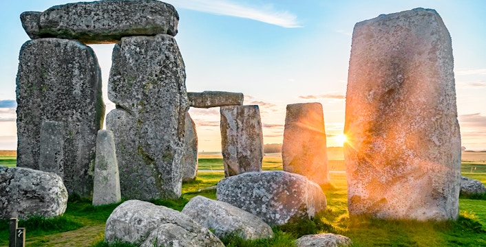 Stonehenge stones at sunrise during a full-day tour from London.