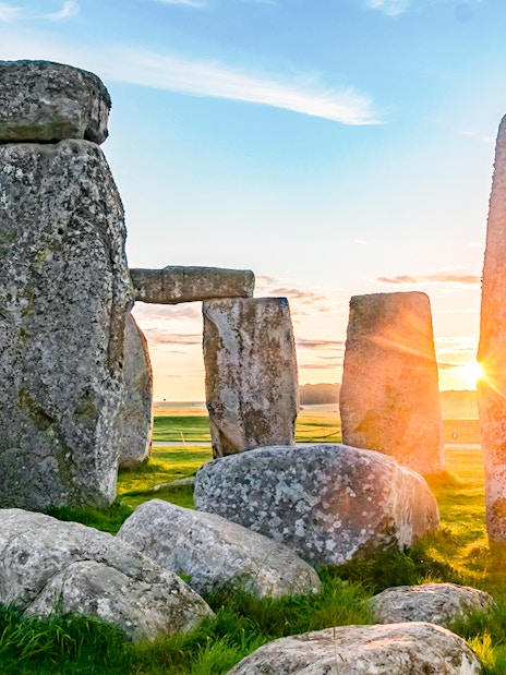 Stonehenge stones at sunrise during a full-day tour from London.