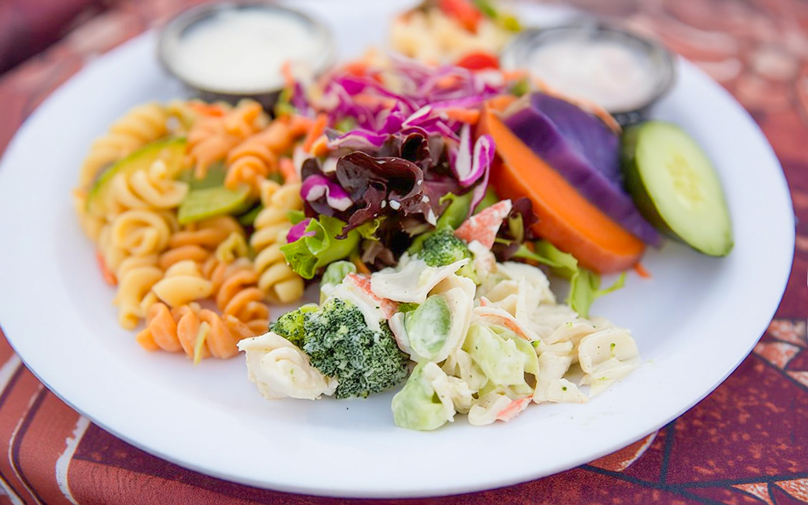 Plate of mixed salads and pasta at Paradise Cove Luau, Hawaii.