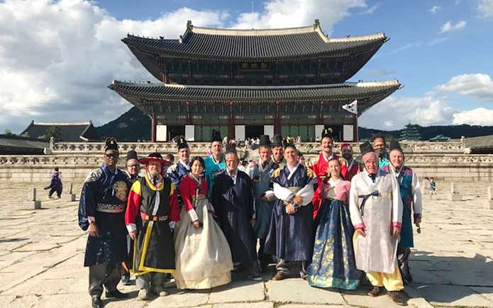 Tour group in Hanbok at Gyeongbokgung Palace, Seoul, South Korea.