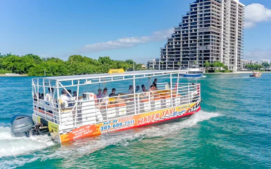 Water taxi cruising near high-rise buildings in Miami.