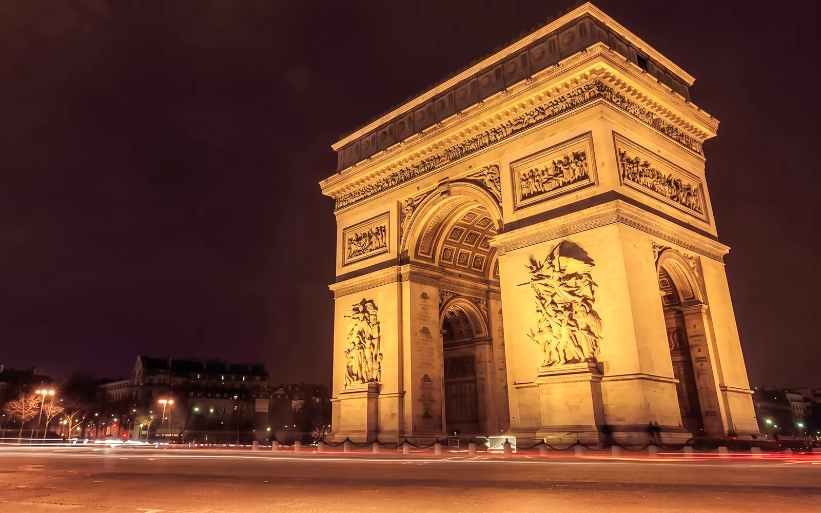 Arc de Triomphe illuminated at night, Paris, related to Mona Lisa Murder Mystery tour.