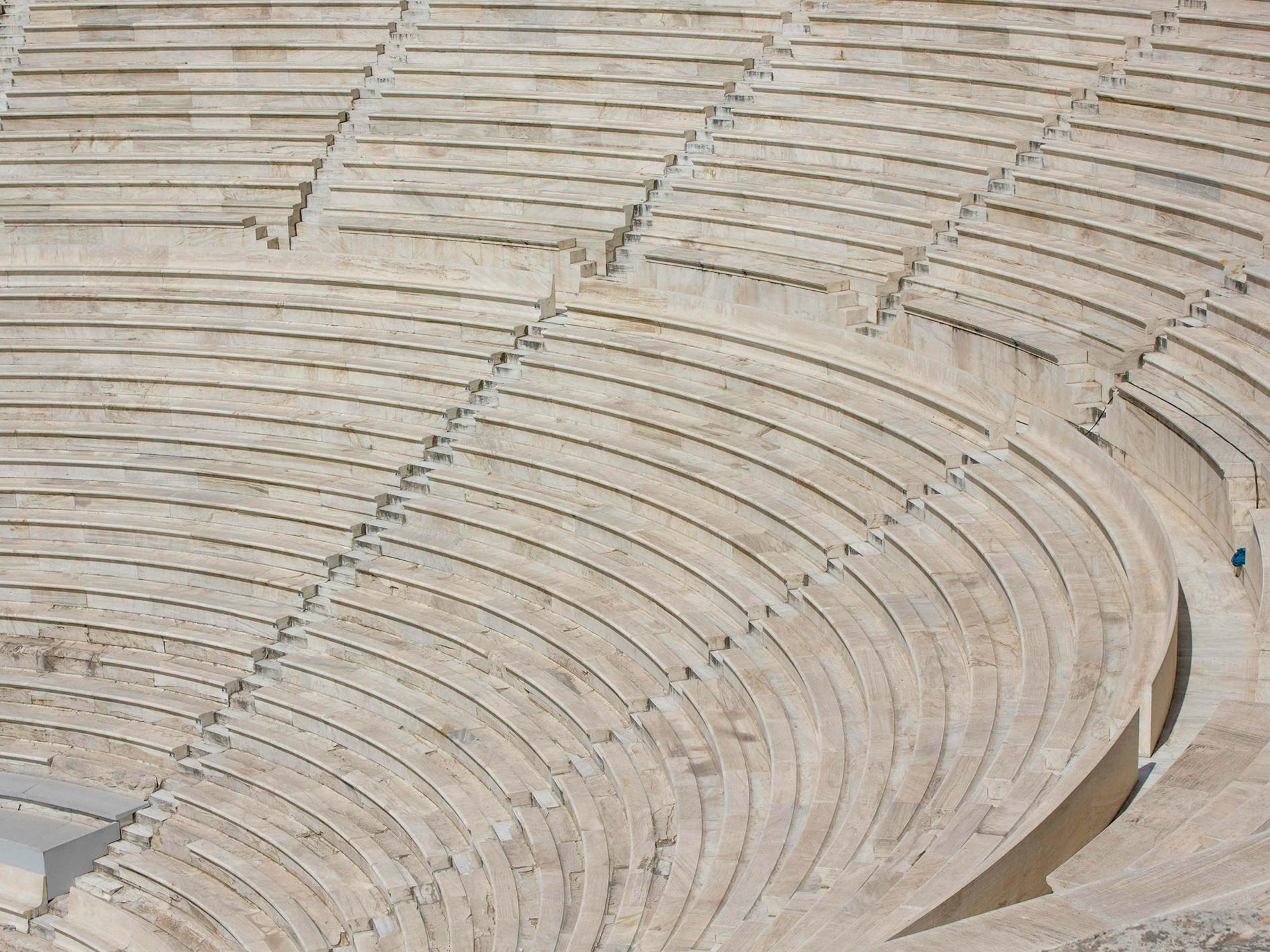Architectural close up of the marble  stone steps of the Odeon of Herodes Atticus amphiteatre ruin in Athen, Greece
