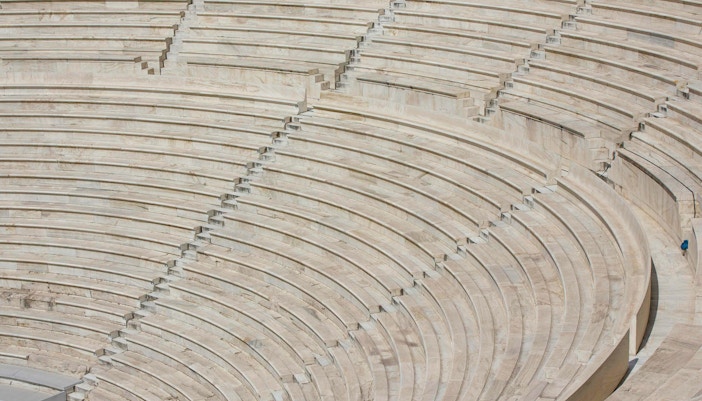 Architectural close up of the marble  stone steps of the Odeon of Herodes Atticus amphiteatre ruin in Athen, Greece