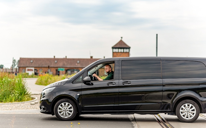 Van near Auschwitz entrance, part of guided tour with transfers.