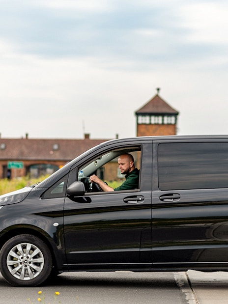 Van near Auschwitz entrance, part of guided tour with transfers.