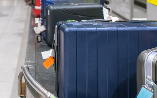 Luggage on conveyor belt at Incheon airport storage service.
