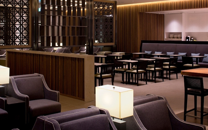 Plaza Premium Lounge seating area at London Heathrow Airport with modern decor.
