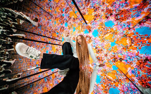 Visitors interacting with vibrant digital displays at House of Hype.
