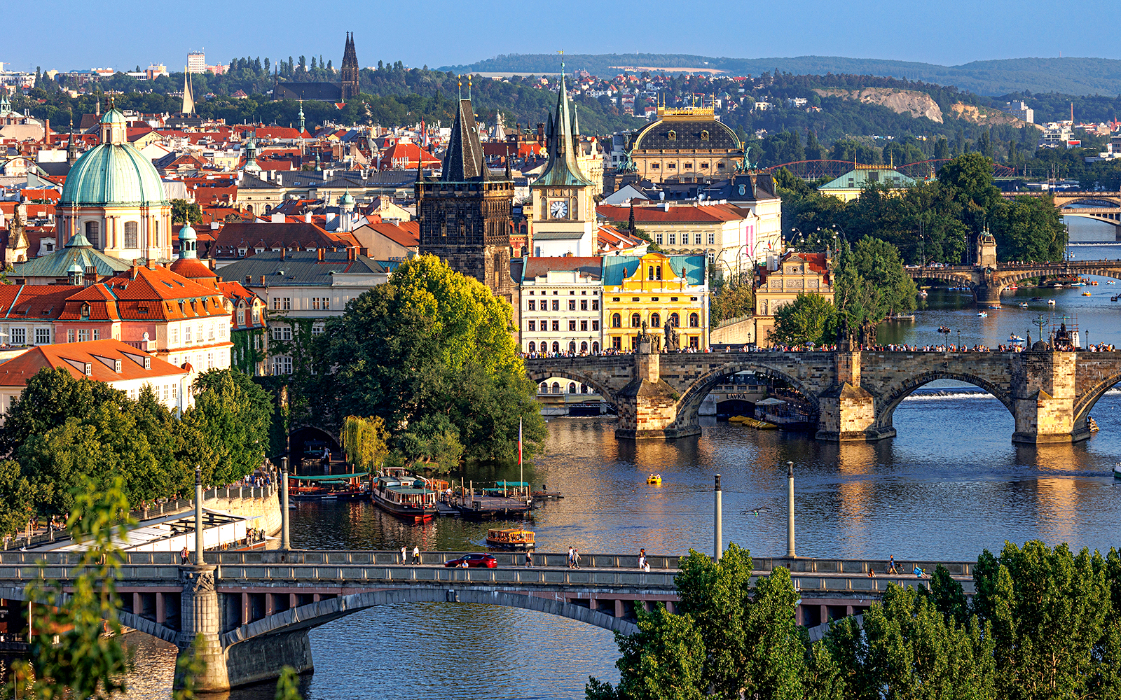 Charles Bridge and Vltava River in Prague, Czech Republic, with historic cityscape.