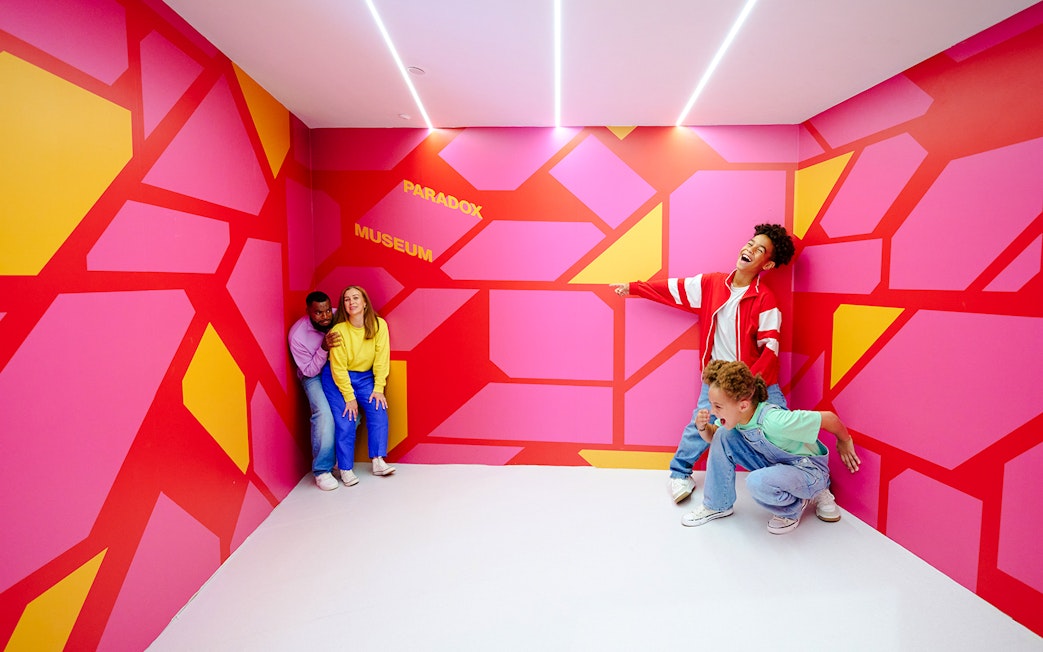 Guests enjoying an interactive exhibit at the Paradox Museum London.