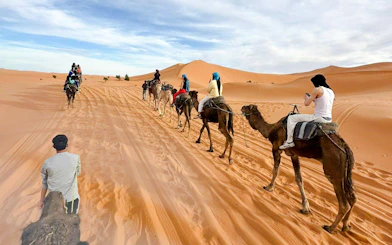 Camel trek through Merzouga Dunes during 3-day desert tour.