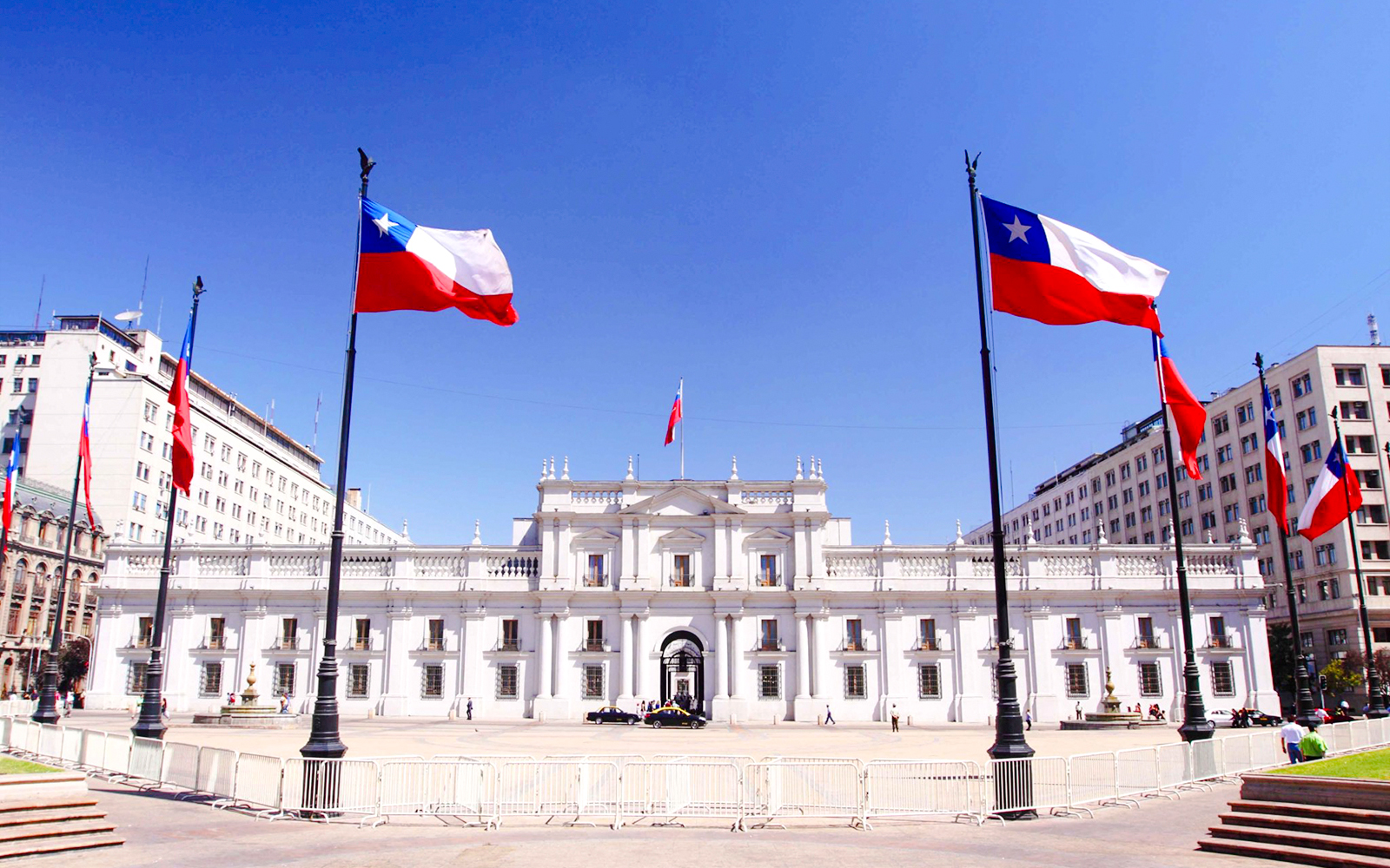 La Moneda Palace in Santiago with Chilean flags.