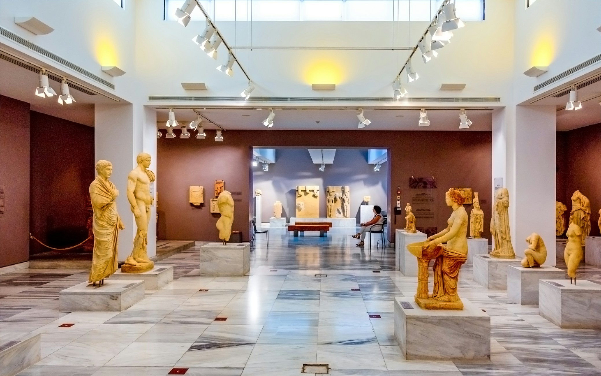 Interior of Heraklion Archaeological Museum with ancient Greek statues, Crete, Greece.