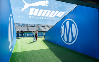OM Guided Tour entrance at CEPAC Vélodrome, Marseille, with visitors exploring.