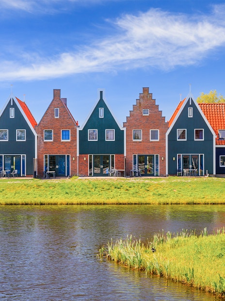 Traditional Dutch houses and windmill in Zaanse Schans, Netherlands.