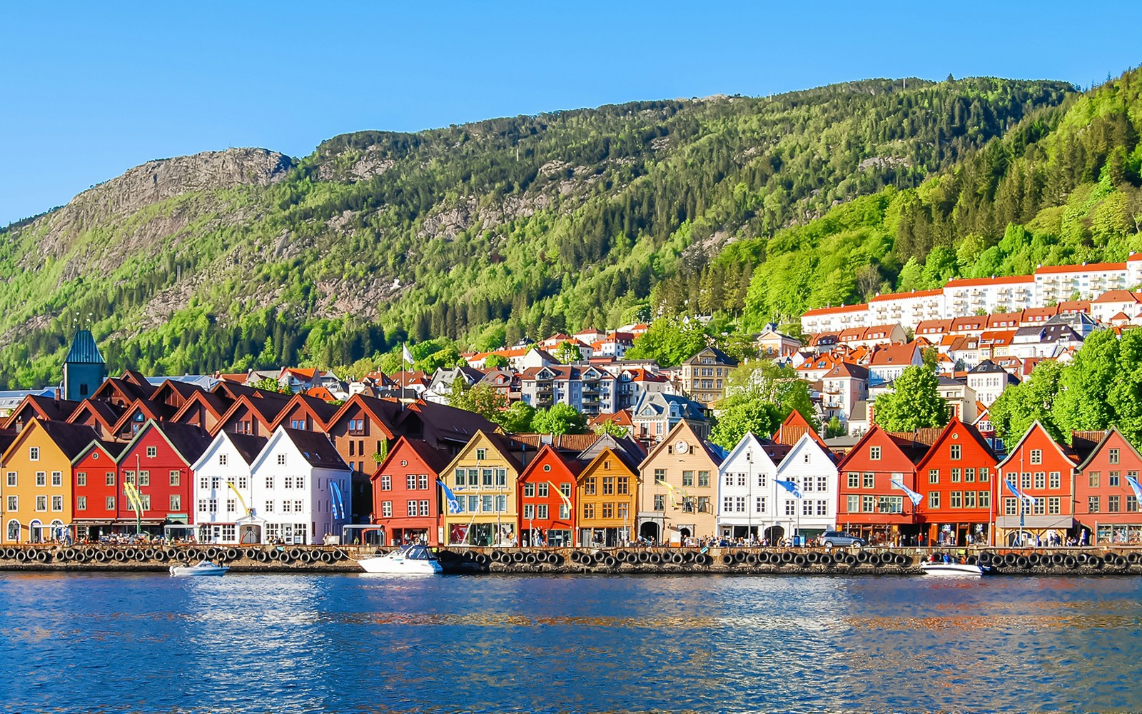 Bryggen wharf in Norway with colorful wooden buildings along the waterfront.