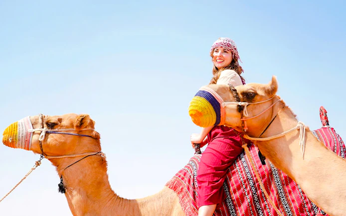 Dubai Red Dunes Desert Safari with BBQ Dinner Camel Ride and Live Shows